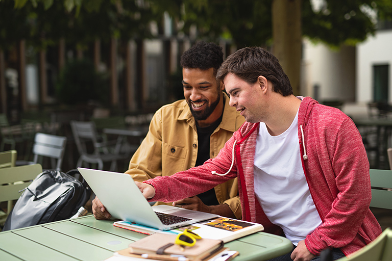 men looking at computer screen together